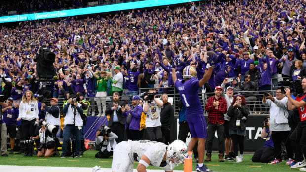 Oct 14, 2023; Seattle, Washington, USA; Washington Huskies wide receiver Rome Odunze (1) celebrates scoring a touchdown against the Oregon Ducks in the late fourth quarter at Alaska Airlines Field at Husky Stadium. Mandatory Credit: Steven Bisig-USA TODAY Sports  